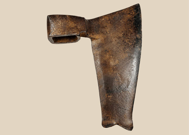 Weathered 19th-century forged iron axe head with dark oxidized finish and split tail end