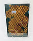 Close-up of Pre-Columbian Chancay textile showing fine cotton fibers and symbolic patterning.