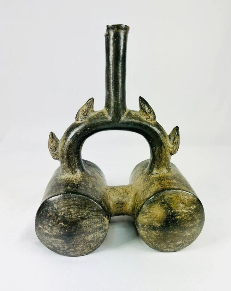 Authentic Pre-Columbian Chimu greyware stirrup vessel, circa 900–1470 CE, featuring double chambers, sculpted spouts, and dark burnished surface.