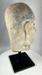 Qing Dynasty carved stone Luohan head with pronounced brows and expressive facial features.