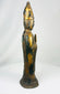 Side profile of a Qing Dynasty Tibetan Lama bronze sculpture with flared base