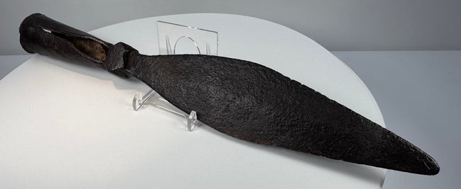Side view of antique Qing Dynasty spearhead showing broad iron blade and tapered socket