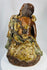Chinese Buddhist folklore figure Jigong with gourd vessels and flowing vine leaves.