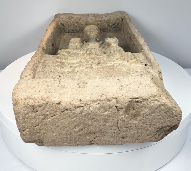Northern Wei Dynasty Buddha brick showing aged earthenware surface, carved devotional figure and recessed sanctuary