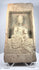 Northern Wei terracotta Buddha relief with circular halo, flowing robes and traces of ancient pigment
