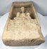 Northern Wei Buddhist architectural fragment featuring seated Buddha beneath a carved temple-style canopy