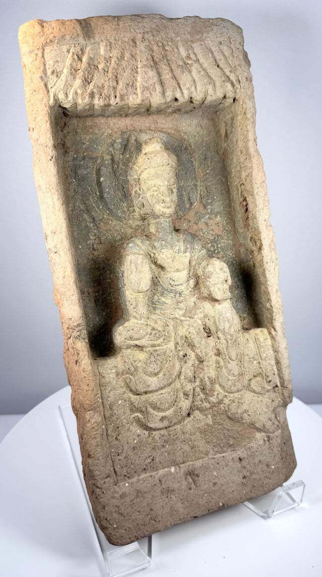 Ancient Chinese architectural brick carved with seated Buddha and temple-inspired canopy, Northern Wei Dynasty