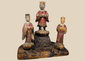 Antique Chinese polychrome wooden shrine group with a central official and two smaller attendants