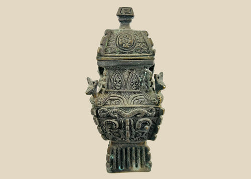 Square Chinese fang yi bronze vessel with roofed lid, cast taotie masks, leiwen ground, curled kui dragons, and zoomorphic shoulder protomes, dark patina with green/blue encrustation, late Qing to early Republic period, ca. 1880–1930.