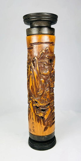Late 19th-century Chinese boxwood incense holder, intricately hand-carved with detailed landscape and figure scenes, cylindrical form with dark-stained end caps; showcases fine Qing-era craftsmanship in wood carving for ritual and domestic use.