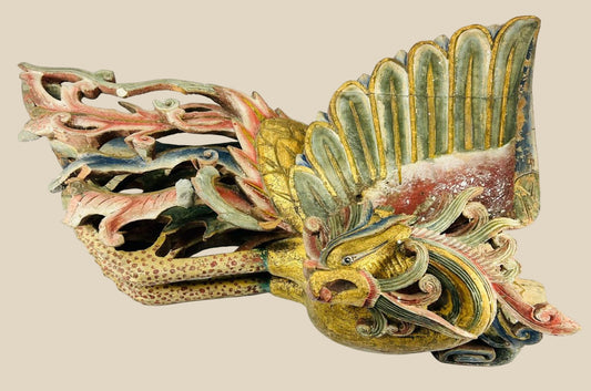 Mid-19th century Chinese carved camphor wood phoenix, detailed plumage with traces of polychrome paint and gilding, symbolizing immortality and prosperity.