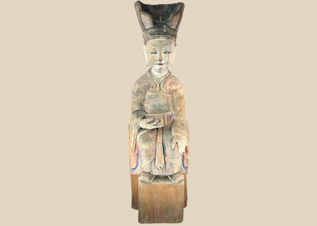 Chinese carved wooden sculpture of a seated court official with original polychrome decoration.