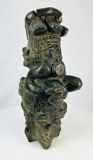 Vintage Chupícuaro-style ceramic figure from West Mexico, depicting a stylized seated form with intricate geometric motifs and applied details. Handcrafted revival piece inspired by pre-Columbian tradition, with dark burnished finish and patina.