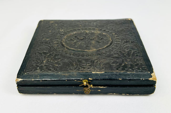 Civil War–era black leather photographic case with gold clasp, closed view