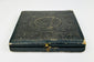 Civil War–era black leather photographic case with gold clasp, closed view