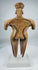 Ancient Colima ceramic female figure with stylized proportions, black painted body decoration, and mineral encrustation.