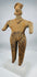 Ancient Colima standing female figure with elaborate headdress, applied decorative details, and archaeological patina.
