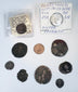 Ten ancient and medieval coins displayed with the Septimius Severus and Ferdinando I identification holders.
