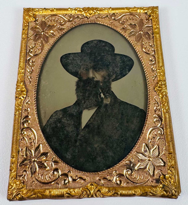 Antique cased portrait of a gentleman in formal Victorian clothing with ornate gilt-brass surround