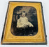 Mid-19th-century cased portrait of a young child seated in formal clothing within a gilt decorative frame