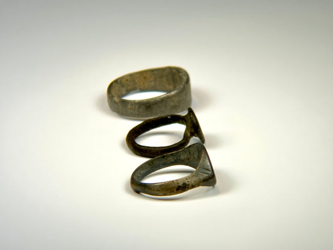 Wide ancient bronze band ring with simple design and naturally developed surface patina