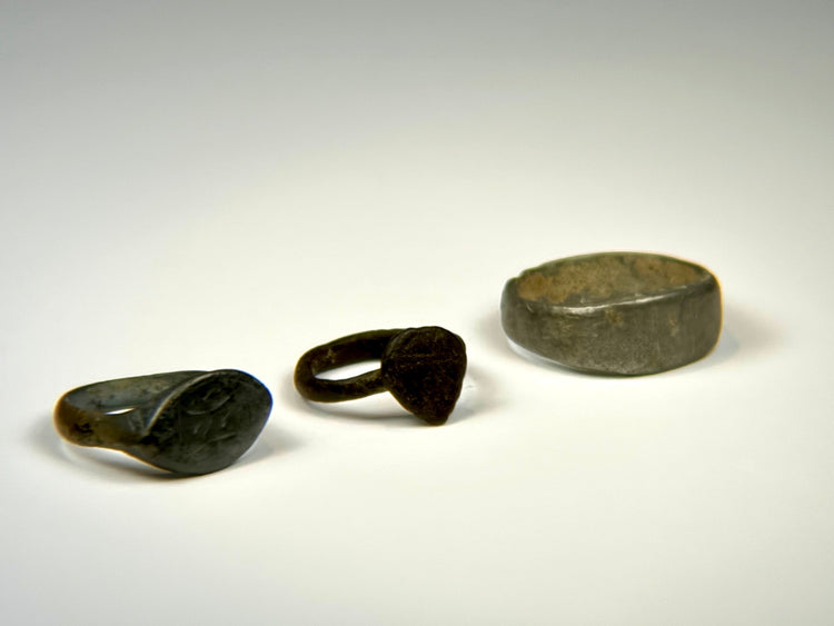 Historic bronze oval bezel ring with tapered band and centuries-old green-brown patina