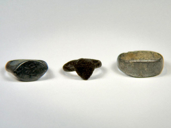 Group of three ancient bronze finger rings spanning the Roman to Medieval periods