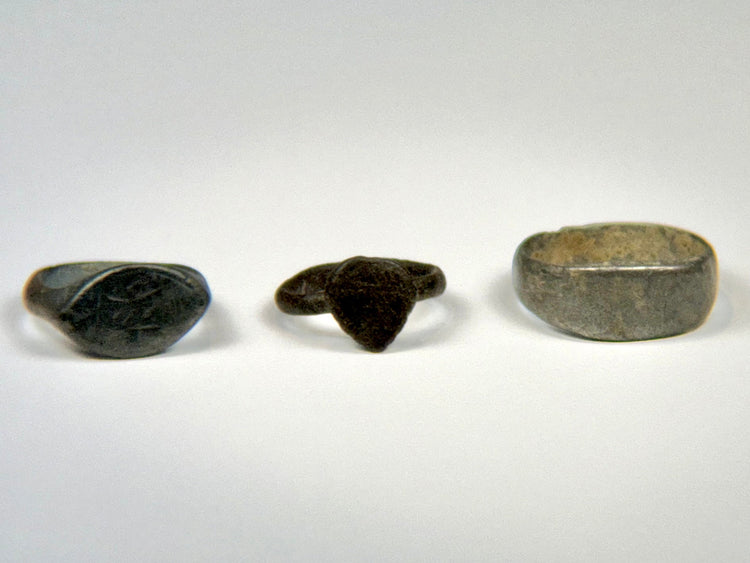 Group of three ancient bronze finger rings spanning the Roman to Medieval periods