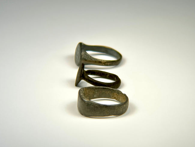 Roman and Medieval bronze ring group displaying centuries of natural patination and surface wear