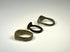Three historic European bronze rings with engraved, shield-form, and plain band designs