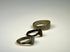 Ancient bronze ring with symbolic shield-form bezel, rounded band, and textured patina
