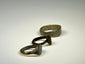 Ancient bronze ring with symbolic shield-form bezel, rounded band, and textured patina