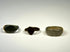 Ancient European bronze rings with oval signet bezel, shield-shaped bezel, and wide plain band