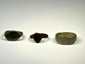 Ancient European bronze rings with oval signet bezel, shield-shaped bezel, and wide plain band