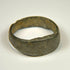 Heavy ancient bronze band ring with wide profile and mottled green-brown patina
