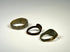Medieval bronze finger ring displaying a solid band and weathered heart-like bezel