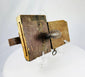 Detail view of aged hardwood lock body with original wrought iron hardware