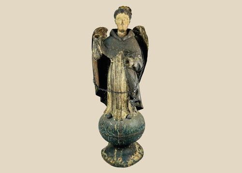 Antique Colonial Latin American polychrome wooden angel or saint figure, 18th–19th century, standing on orb base, gilded wings, remnants of original painted surface, later added sterling silver chain and cross marked 'Sterling, Mexico', traditional folk-religious craftsmanship