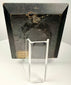 Rear view of worn ebonized frame with metal ring for hanging