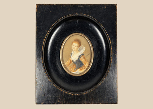 Mid–late 19th-century Continental European miniature portrait of a young woman in historicizing costume with deep blue bodice, amber sleeves, and lace ruff, watercolor/gouache on thin wafer, signed lower right, in ebonized wood frame with oval brass bezel, after Fragonard, circa 1860–1890.