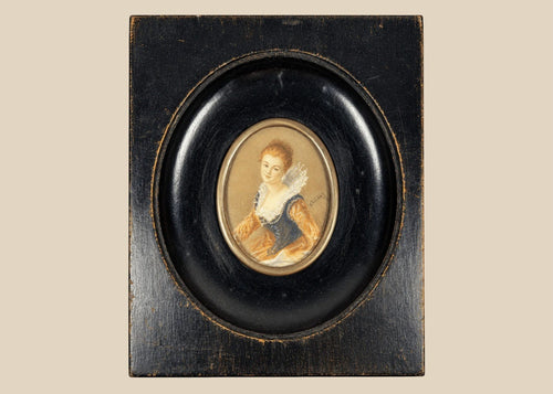 Mid–late 19th-century Continental European miniature portrait of a young woman in historicizing costume with deep blue bodice, amber sleeves, and lace ruff, watercolor/gouache on thin wafer, signed lower right, in ebonized wood frame with oval brass bezel, after Fragonard, circa 1860–1890.