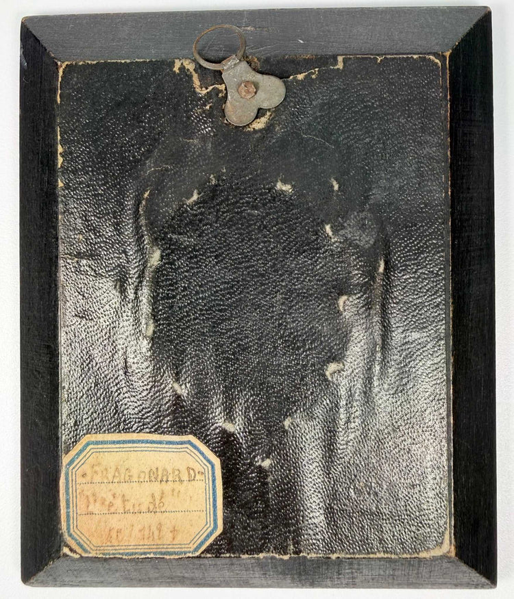 Back view of framed historical art with hanging loop and Fragonard label