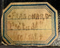 Close-up of Fragonard label on 19th century miniature portrait frame