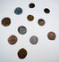 Medieval bronze coins displaying Christian crosses and remnants of period inscriptions