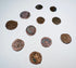 Eleven historic Levantine coins showing varied sizes, shapes, and struck designs