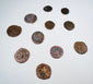 Eleven historic Levantine coins showing varied sizes, shapes, and struck designs