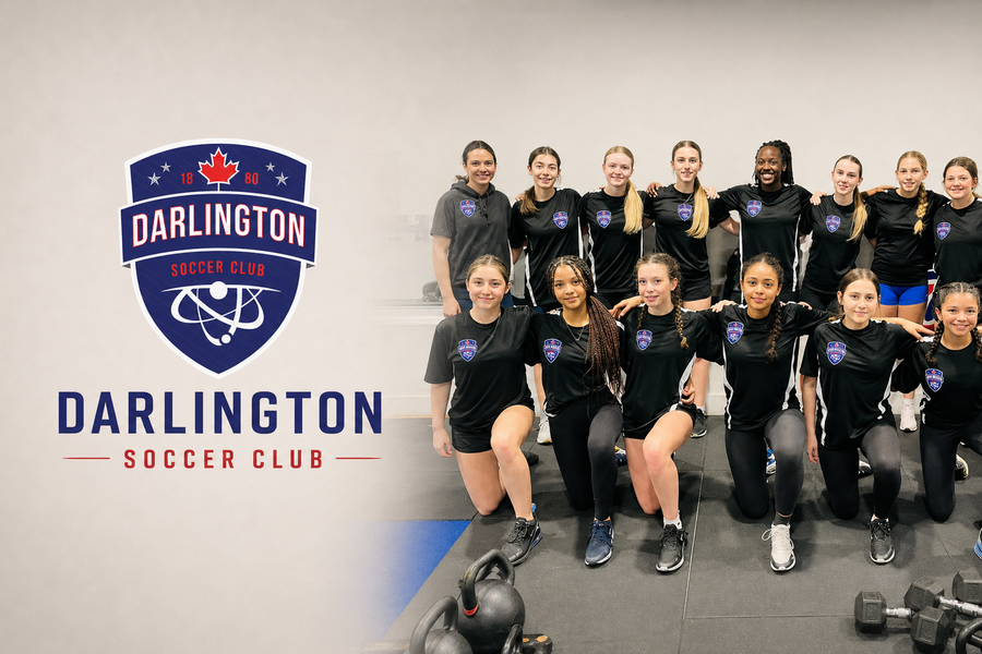 Darlington Energy U15 girls soccer team posing in training uniforms alongside the Darlington Soccer Club logo, representing youth sponsorship supported by Relic & Rarity.