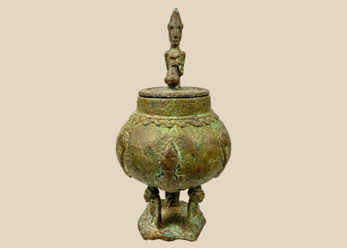 19th century Dogon bronze ritual container with anthropomorphic figure lid and embossed spiral motifs