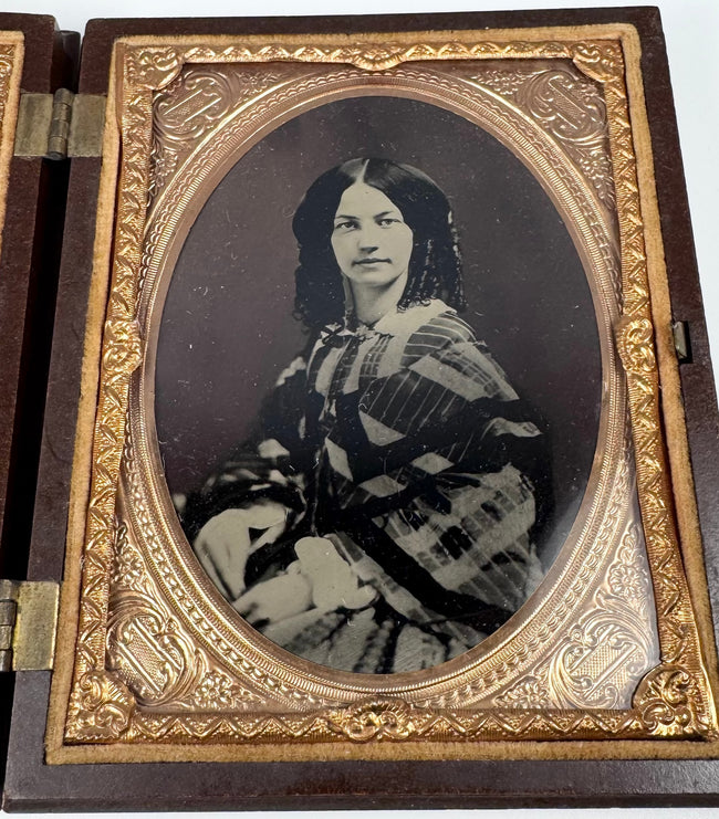 Victorian photographic case containing portraits of a formally dressed man and woman