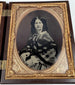 Victorian photographic case containing portraits of a formally dressed man and woman